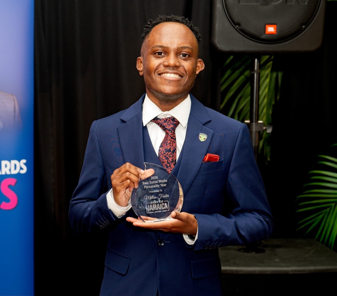 Milton Foster holding his Best of Jamaica award